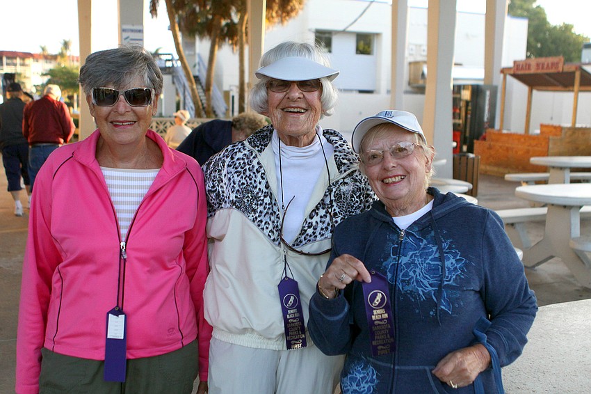 Joan Bloom, Leni Markell and Marcia Horn pose inside the pavilion before heading off towards the beach for the Senior Beach Walk, Wednesday, Feb. 1.