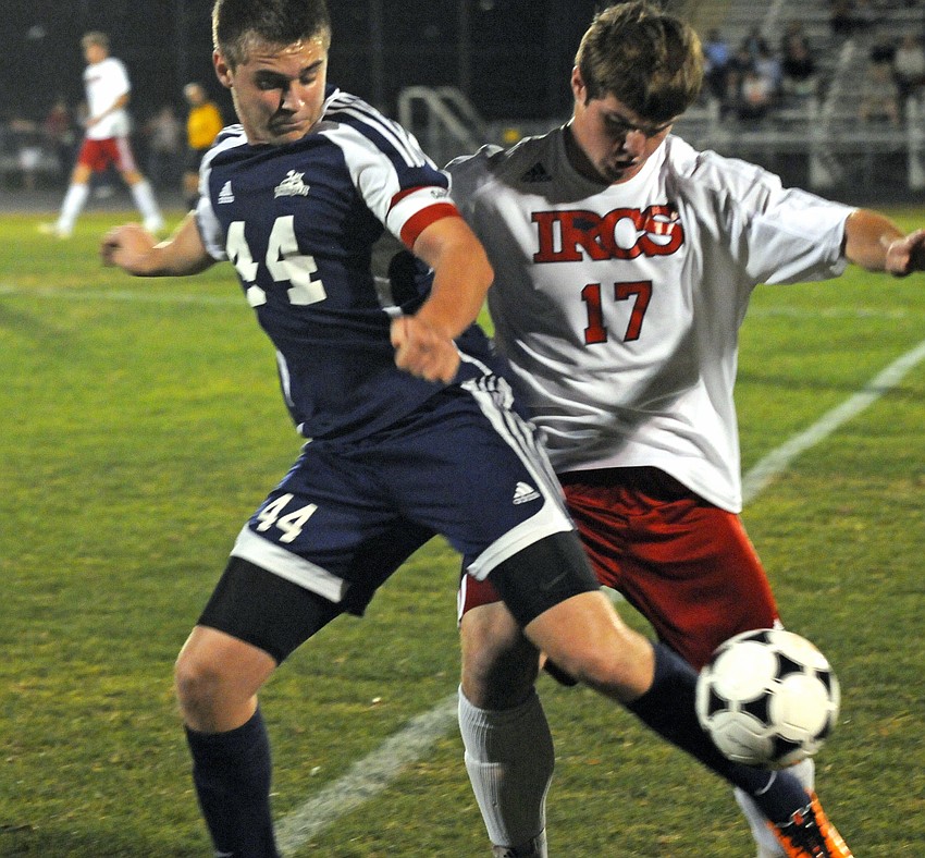 The Out-of-Door Academy senior Harry Lempriere and Indian Rocks Christian School senior Chad Gessner battle for position.
