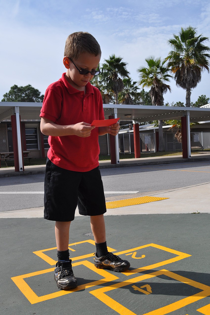 Seven-year-old Christian Lebon mastered the hop scotch activity.