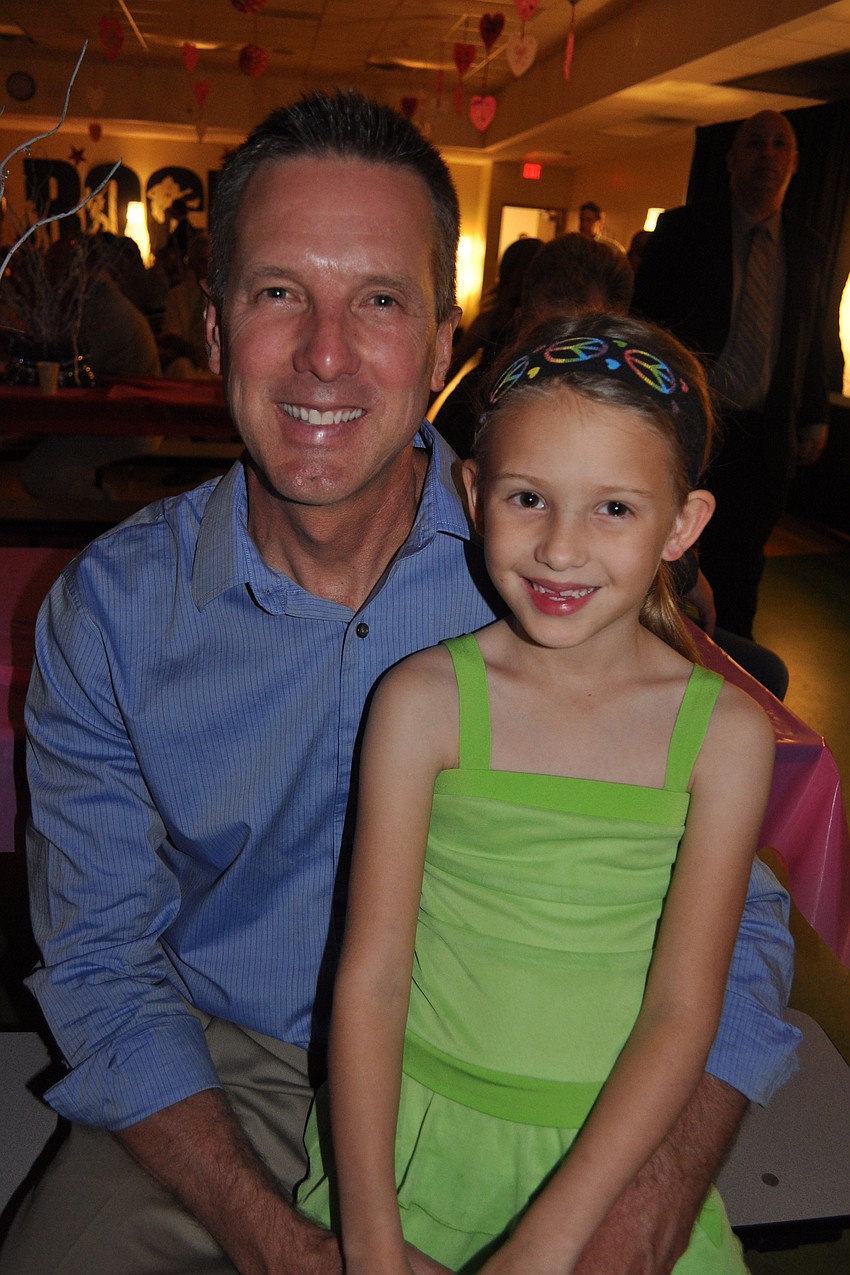Brent Barker and his daughter, Ellie, took a break from dancing.