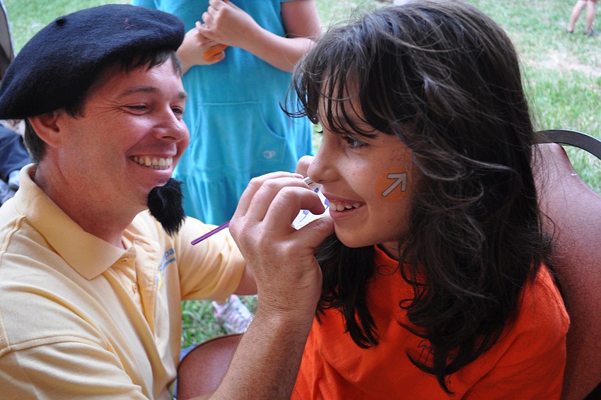 Scott Barrett painted a snake on the face of his daughter, Amanda.