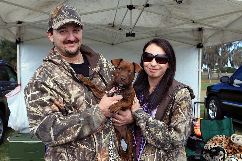 Matt and Dani Paret with their 13-week-old puppy, Whiskey.