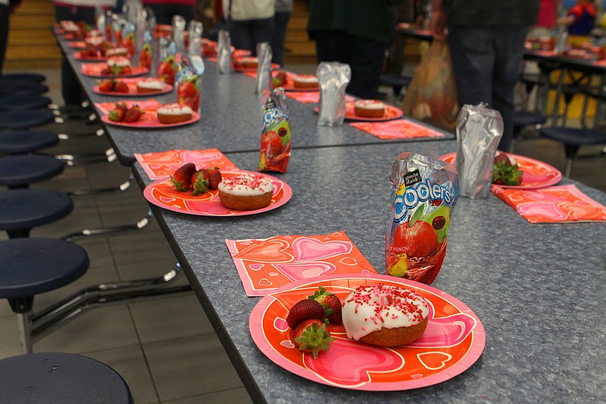 Breakfast included juice, strawberries and Dunkin' Donuts donuts.