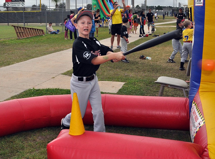 Eight-year-old Dylan Bowles is playing baseball for the first time this spring.