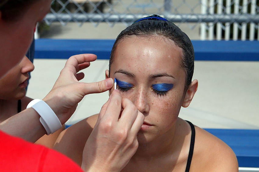 Anna Phillips gets her eye makeup applied prior to performing, Sunday, Feb. 19.