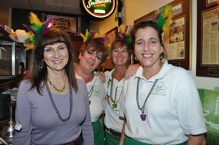 Employees Mirta Klauber, Jill Davis, Bridgette Allen and Amy Lowe wear headbands made by Davis.