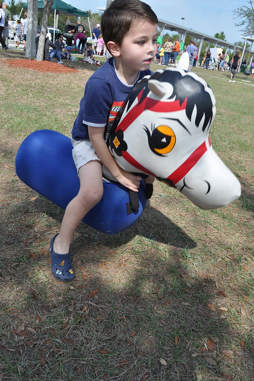 Four-year-old Cooper Henry raced his pony as fast as he could.