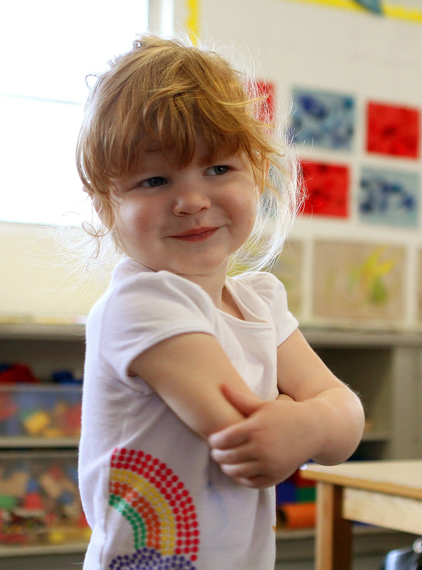 Isla Cawley, 2, gives herself a hug during the 