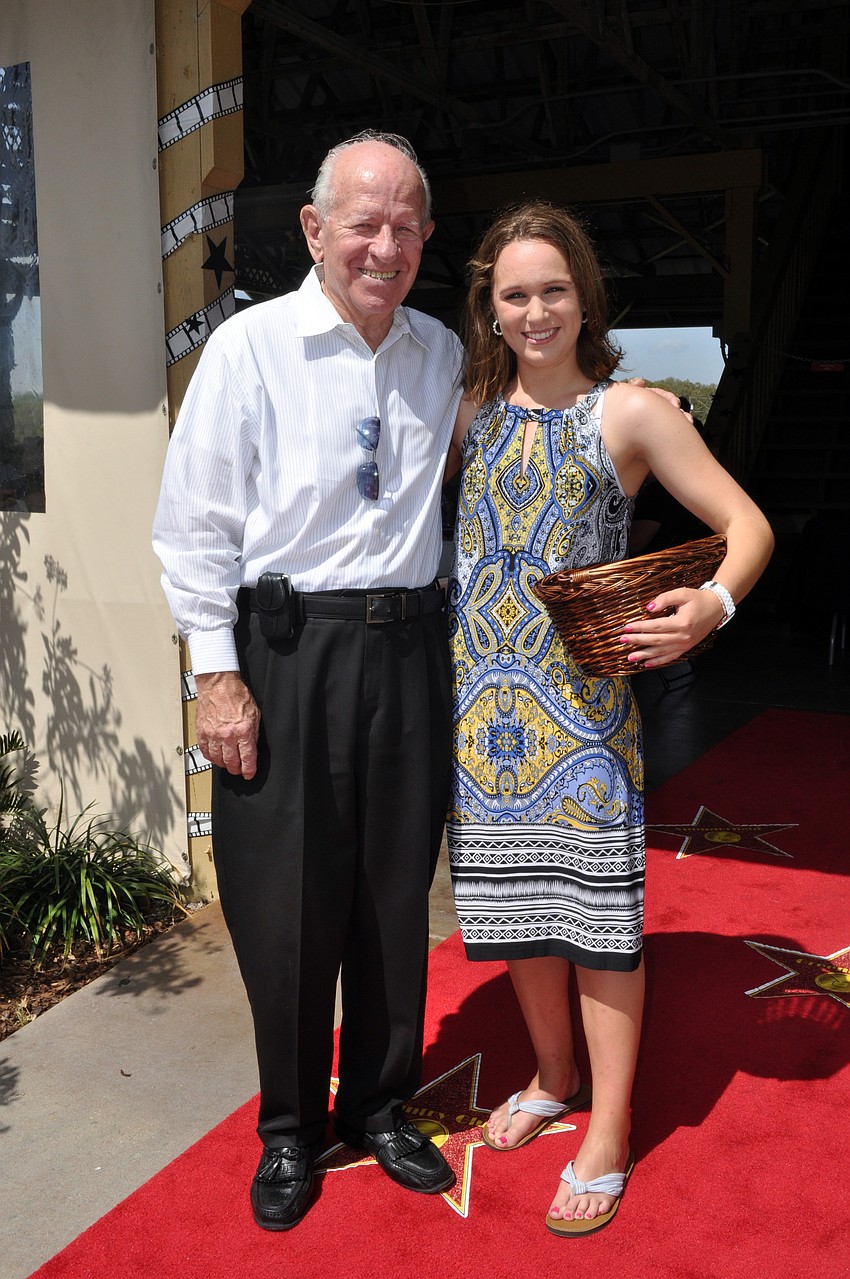 Edgewater resident Don Oâ€™Leary was greeted on the red carpet by Wing Ding volunteer Lauren Redington.