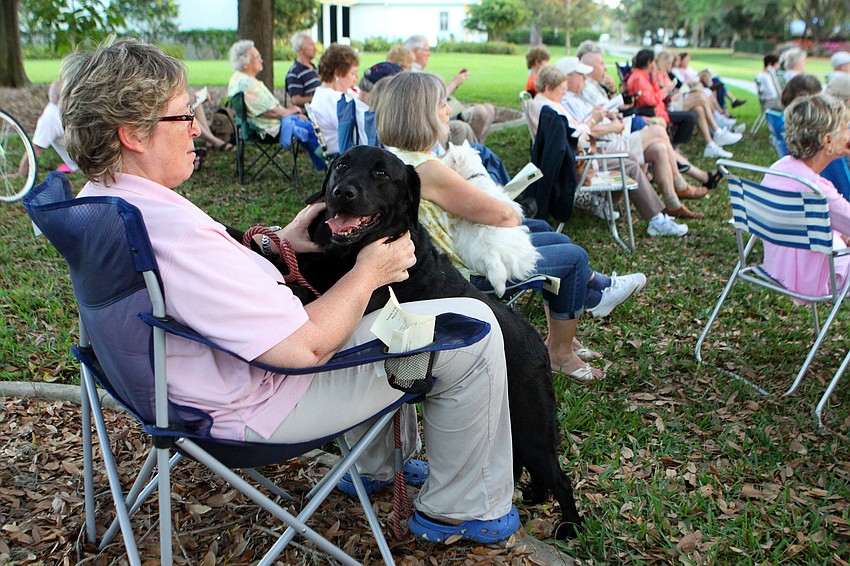 Terri Jo Crego and her dog Roro watch the Sounds of the Soul service, Friday, March 2.