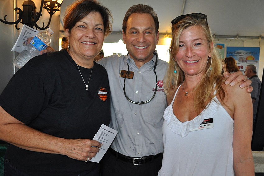 Nick Zec, of Boyd Insurance & Investment, center, caught up with Teri Mills and Laura Strub-Potter, of Construction Supply of Southwest Florida.