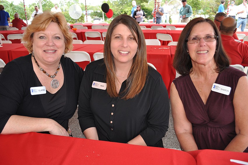 Elaine Black, Mary Orme and Sharon Edwards, of North American Title Co., enjoyed the barbecue.