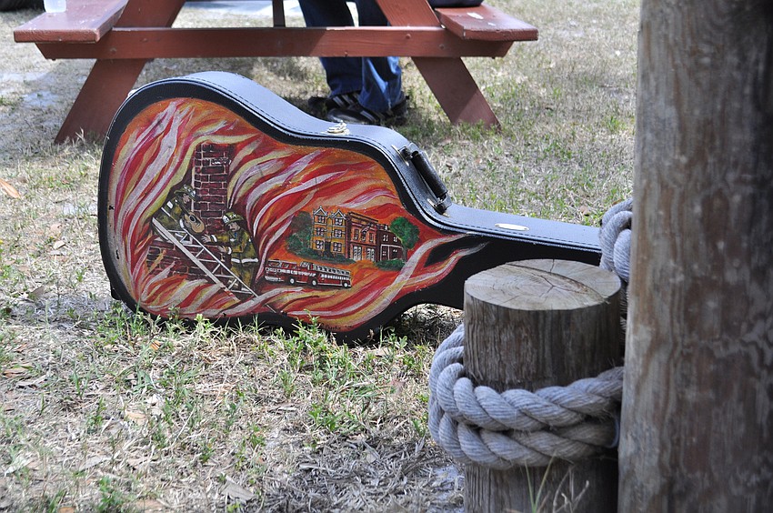 This guitar case was decorated with custom artwork.