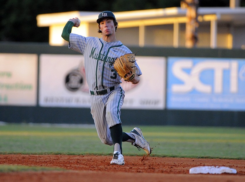 Lakewood Ranch junior Kevin Leone looks to make a throw back to first base.