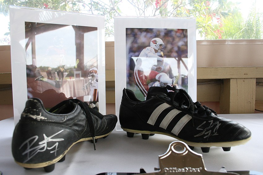 The silent auction featured a plethora of items, including these cleats from NFL kicker Martin GramÃ¡tica.