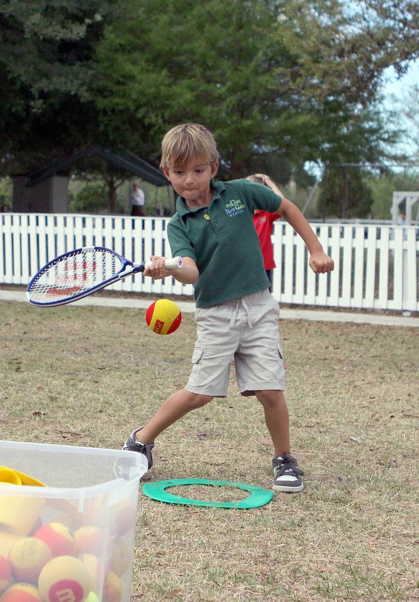 Dylan Foley, 6, goes to hit the ball, Tuesday, March 20.