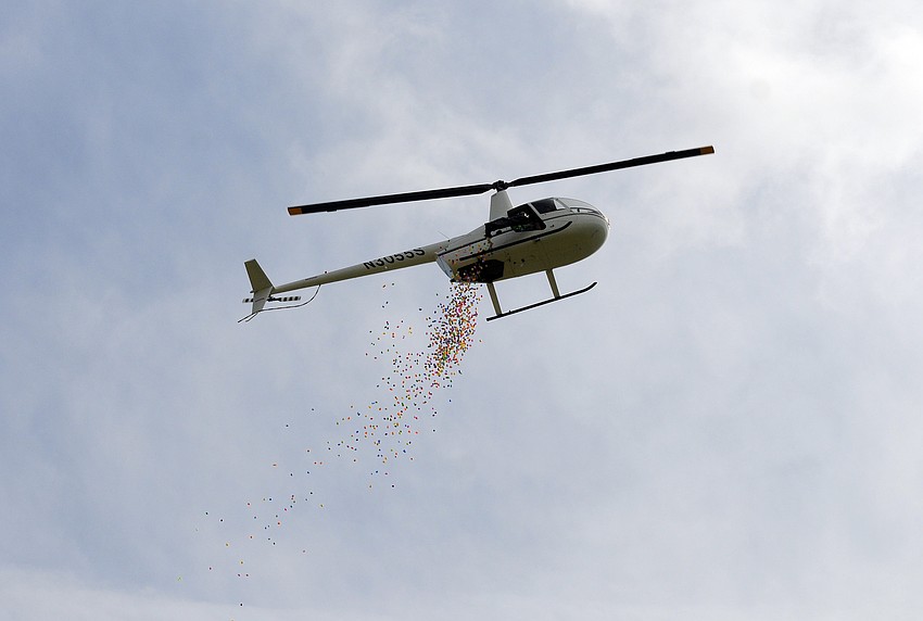 A helicopter dropped 10,000 eggs to go along with the 40,000 eggs waiting to be collected on the fields below.