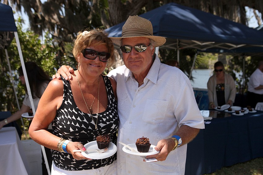 Patti and Gary Bushorr enjoy cupcakes from Cupcakes By Ron, Sunday, April 1, at All Faiths Food Bank Jazz Brunch in the Park out at Phillippi Estate Park.