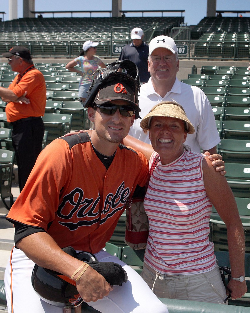 Ryan Flaherty poses with family friends from Main, Rick and Ann Coffey.
