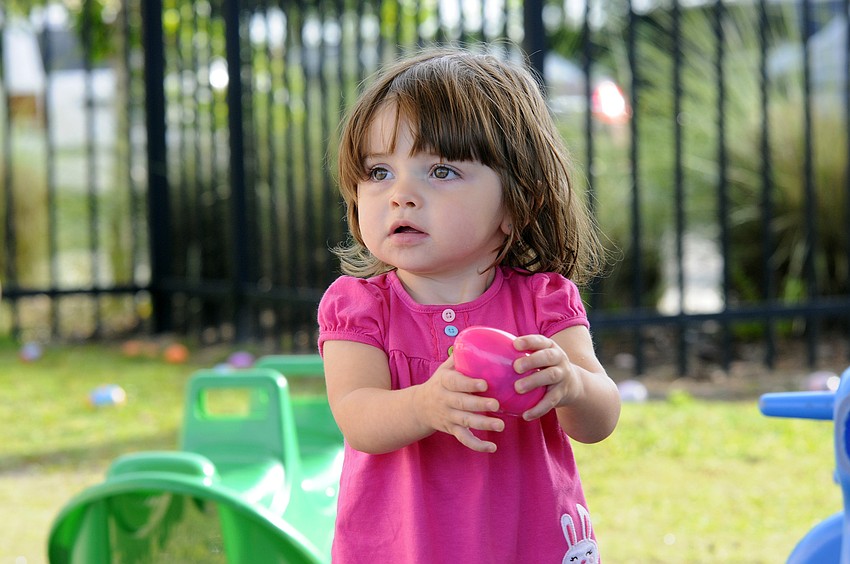 One-year-old Natalia Simone was one of the first children in her class to collect an Easter egg.