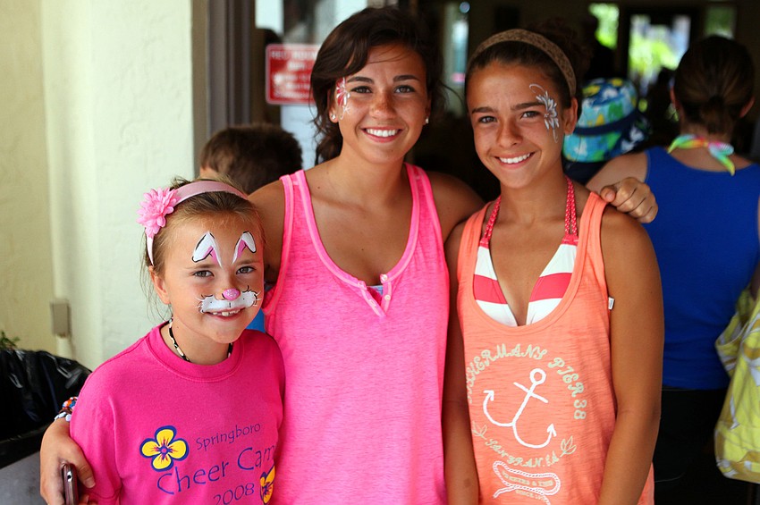 Holly Stachler, 8, Erin Stachler, 15, and Katie Stachler, 2, all had their faces painted, Thursday, April 5, at Siesta Dunesâ€™ egg hunt.