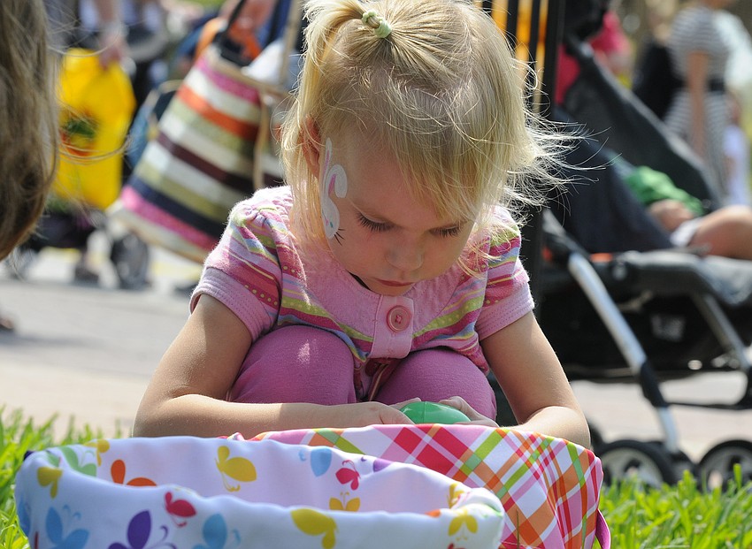 Three-year-old Sarah Lawson carefully examined each one of her eggs.