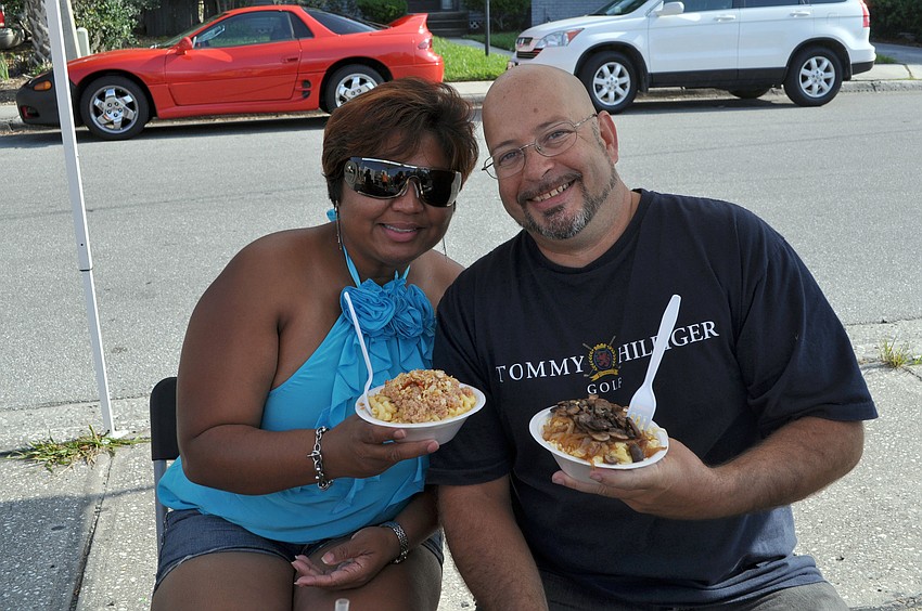 Iris Bernard and DJ Dan enjoy some macaroni and cheese from Oâ€™Macalicious, Friday, April 13, during Ringling Picnicâ€™s Spring Fling.