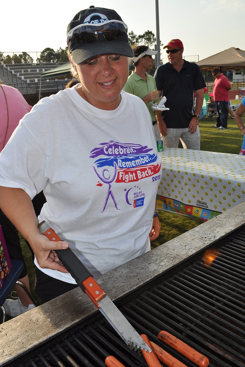 Michelle Lea grilled hot dogs for the event.