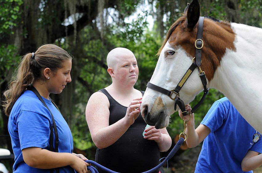 Sixteen-year-old Melissa Mungo, who loves horses, got to groom one for the very first time. â€œI feel like they can understand,â€ she says.