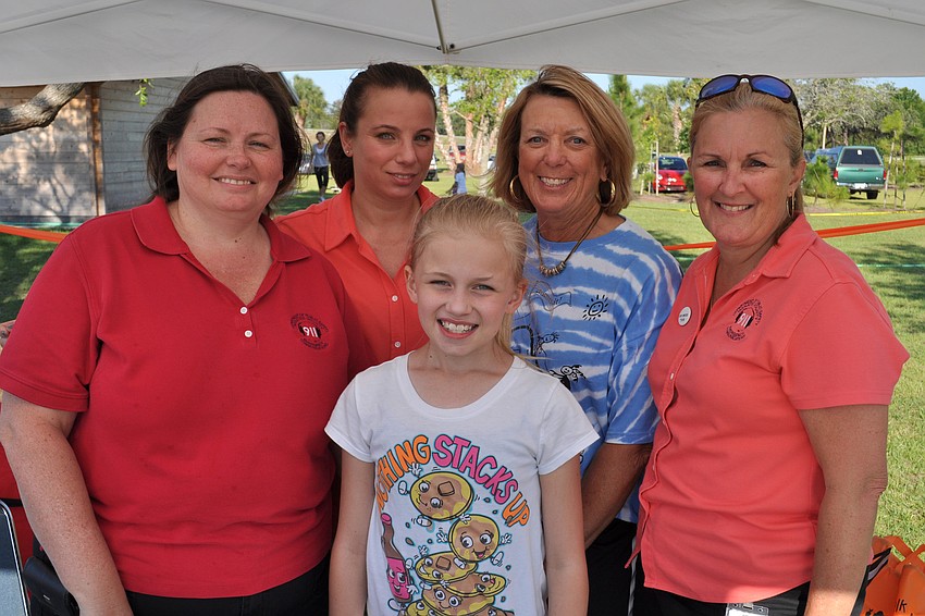 Melody BonAmi, Stacy Needham, Kara BonAmi, Carol Miers and Tammy Robinson, of the public safety department, registered attendees.