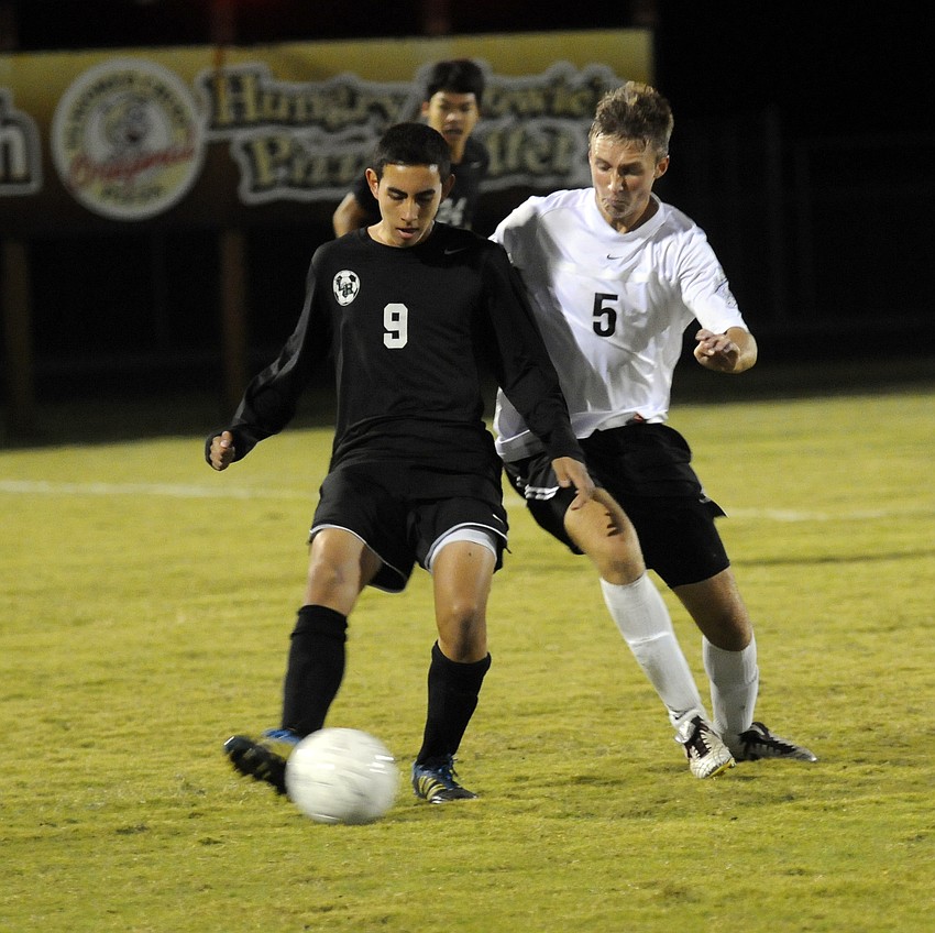Lakewood Ranchâ€™s Jimmy Jaime, left, tries to maneuver the ball past Braden Riverâ€™s Matt McNab.