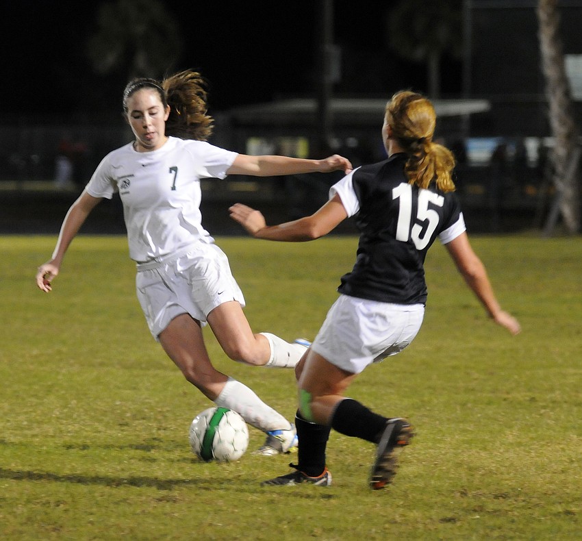 Lakewood Ranch senior Haley Martin looks to get the ball past Braden Riverâ€™s Faith Pearce.