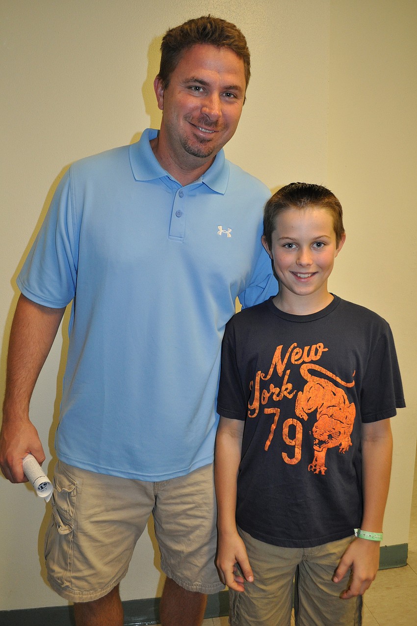 Bill Jula and his son, Peyton, checked out the school.