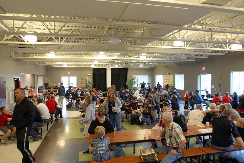 The cafeteria was packed with dads enjoying donuts with their children, Friday, Jan. 13, at the Imagine School in Palmer Ranch.