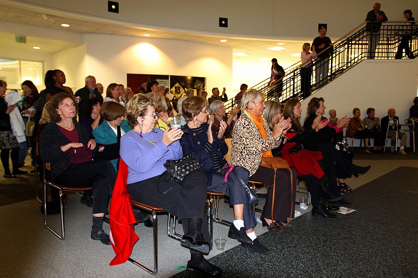 The crowd claps during FST's improv performance, Friday, Jan. 13, at Selby Public Library's Looking Into the Crystal Ball event.