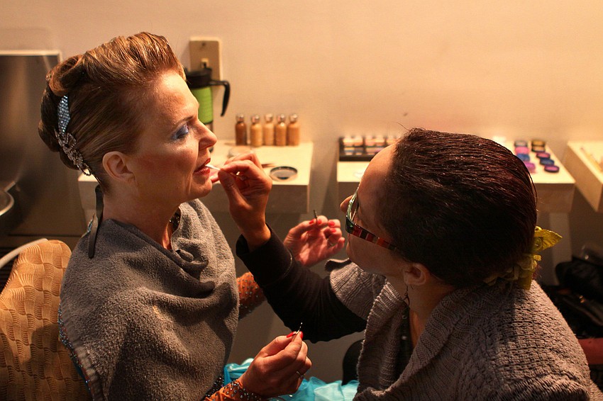 Margy Sivertsen gets her makeup done by Margaret Burns, Sunday, Jan. 15, before competing in the Sarasota Challenge at the Hyatt Regency.