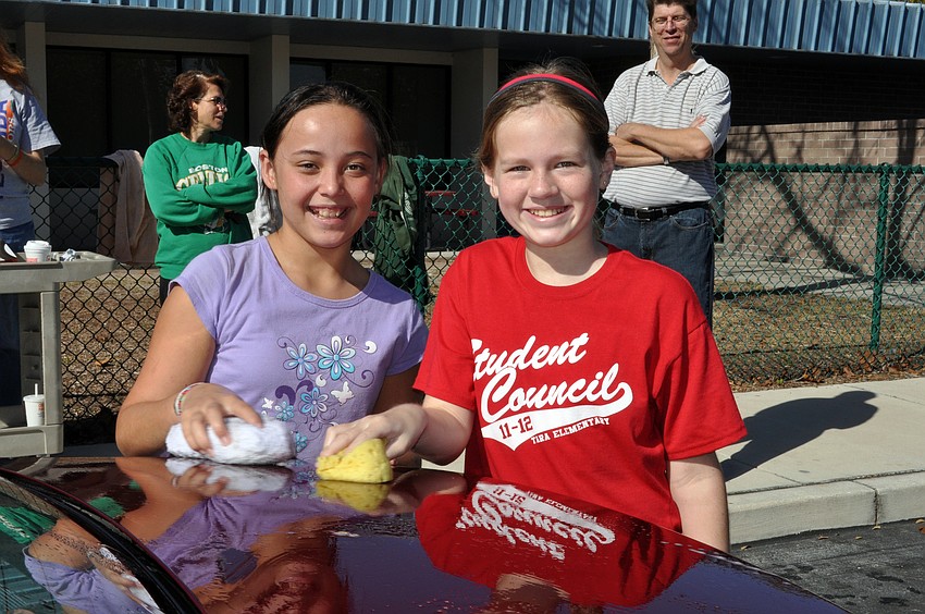 Eleven-year-olds Zoe Marsh and Rachel Toole had fun washing cars.
