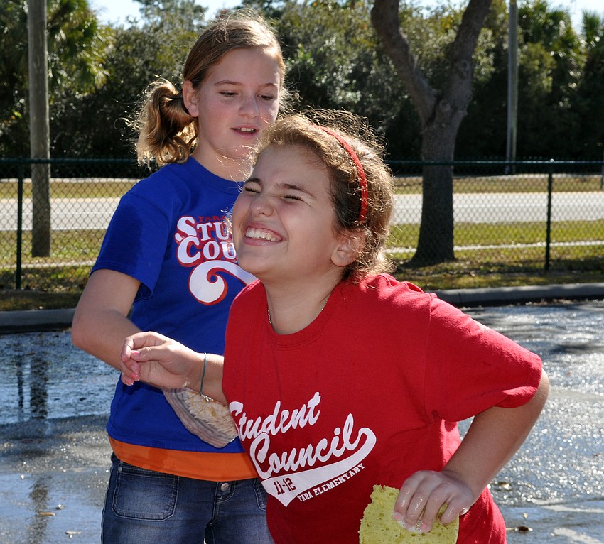 Eleven-year-old Katie Cardinale catches 10-year-old Brighid Traugutt off guard.