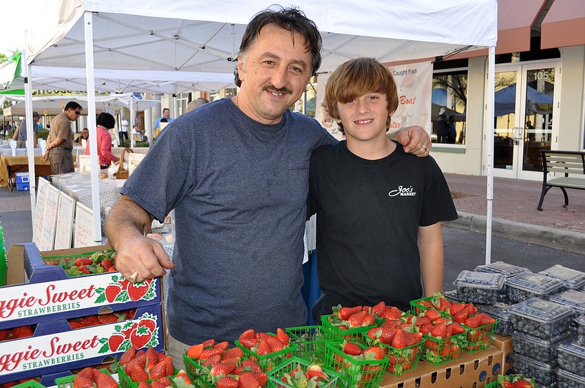 Joe Osmani of Joeâ€™s Market in Clearwater and Oldsmar and his son Joey, 11, set up their produce stand every Saturday.