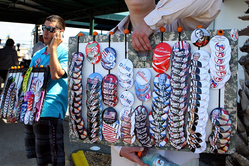 Supporters sold buttons outside Dolphin Aviation, Tuesday, Jan. 24.