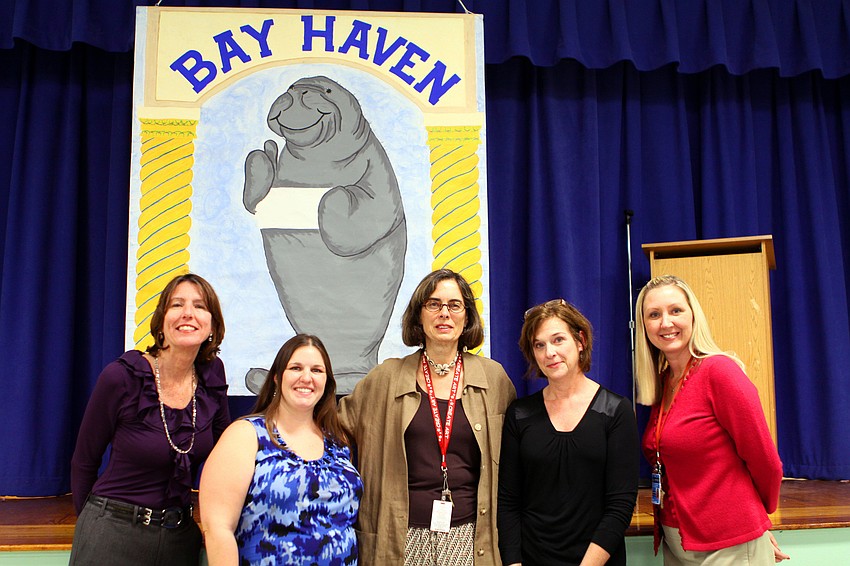Betsy Asheim, principal, Michala Chipurnoi, third grade, Gail Bruder-Werner, art teacher, Mary Grand Pre, illustrator and mom, and Janel Dorn, assistant principal, pose together, Wednesday, Jan. 25, during Build a Book at Bay Haven.