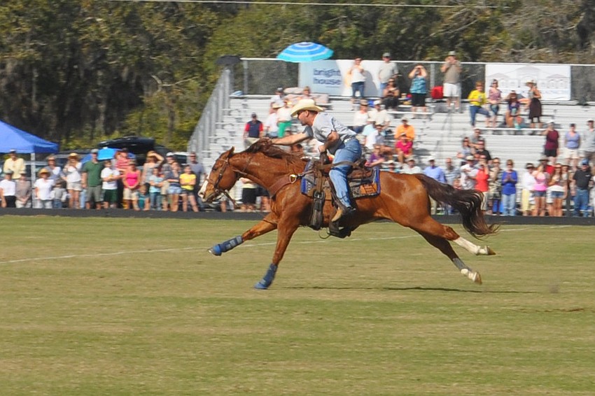 Cowboys and polo players competed in a horse race at half time as part of SMR Cup festivities.
