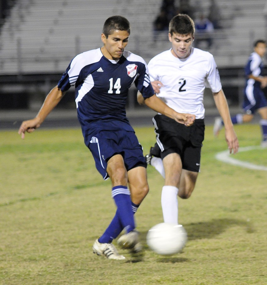 Manateeâ€™s Carlos Reyes and Braden Riverâ€™s Ivo Lima fight to control the midfield.