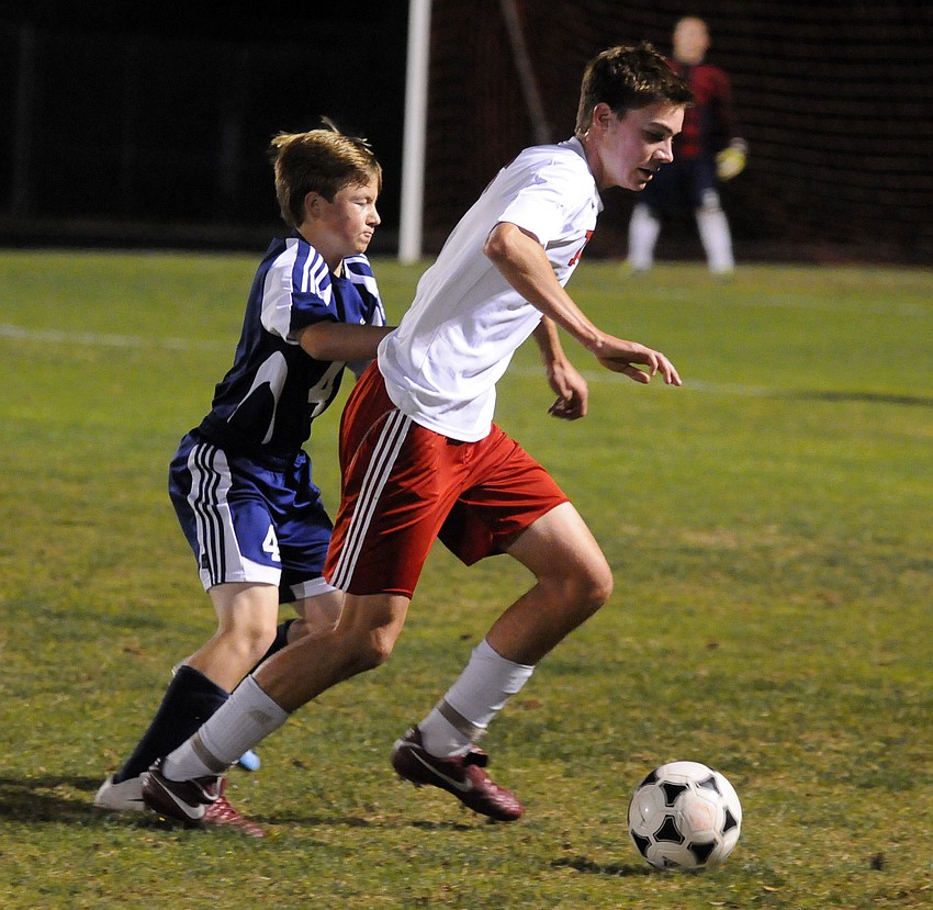 Thunder defender Tyler Wenger looks to keep a Golden Eagles opponent from breaking toward the goal.