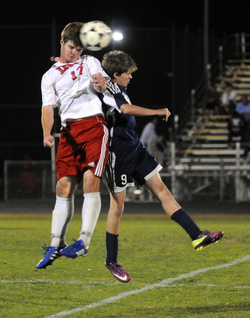 Indian Rocks Christian Schoolâ€™s Chad Gessner and The Out-of-Door Academyâ€™s Carson Jungers both attempt to head the ball.
