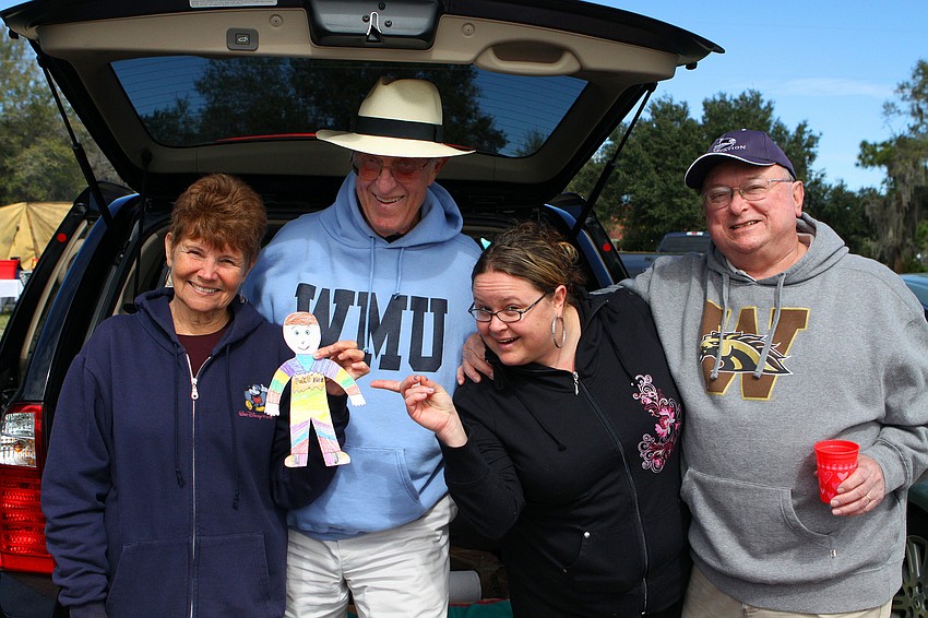 Judy and Dave Cowden with Jen and Jim Sanders pose together with Flat Stanley, Sunday, Feb. 12 at the Sarasota Polo Club.