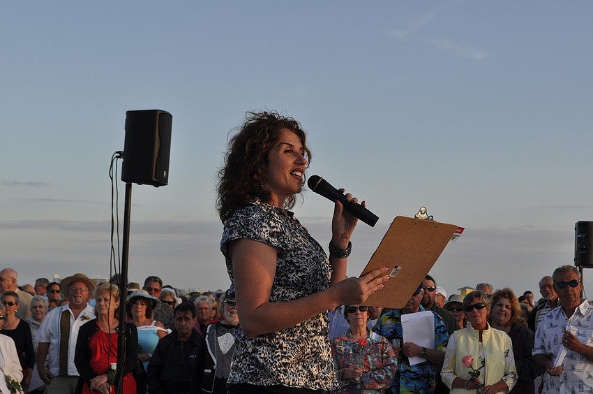 Sandy James, of Marriage and Family Works, welcomes the crowd.