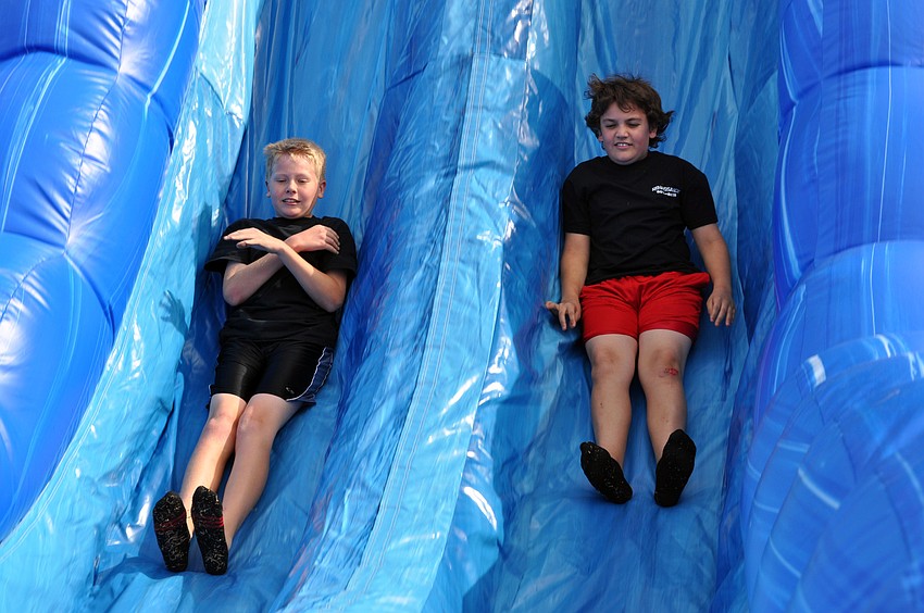 Sixth-graders Nathan Roberts and Ryan Thompson had a blast on the inflatable slide.