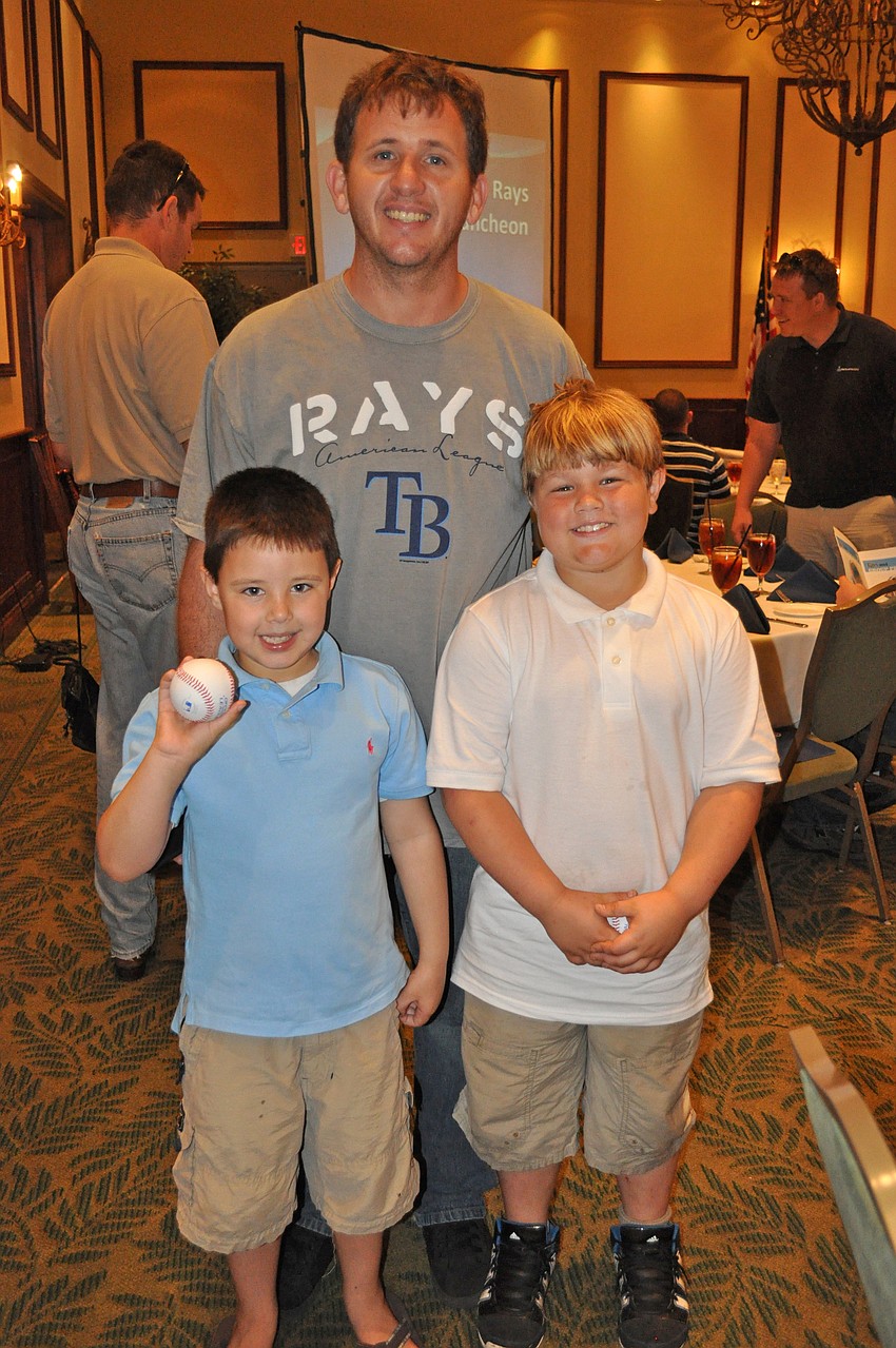 Six-year-old Billy Pardy Jr., pictured with his dad Billy Pardy, and 8-year-old Logan Wendell couldnâ€™t wait to get their baseballs autographed.