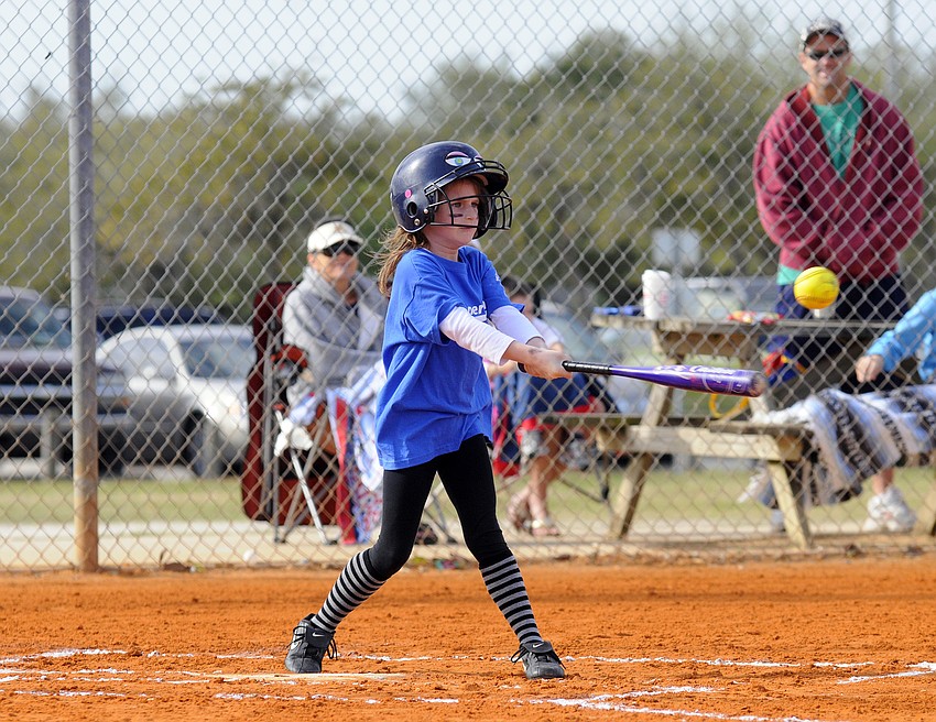 Five-year-old Leah James looks to make contact in her first at bat.